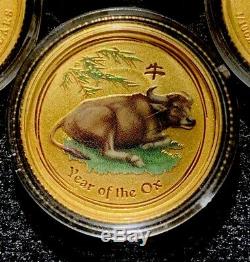 2x 2009 Australia Lunar Year of the Ox 1/10 oz. 9999 gold coins (colorized)