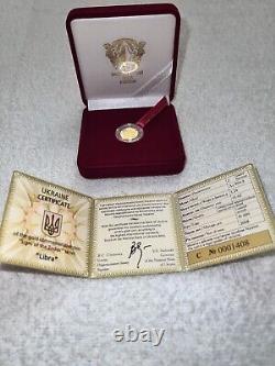 Commemorative gift gold coin Libra in a case. Certificate with 3 signature