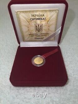 Commemorative gift gold coin Libra in a case. Certificate with 3 signature